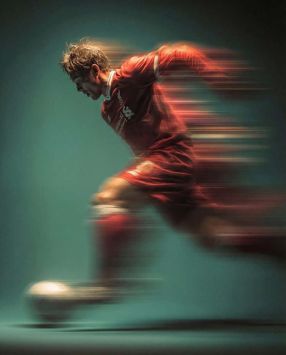 Panning shot of a mysterious soccer player in red proffes...